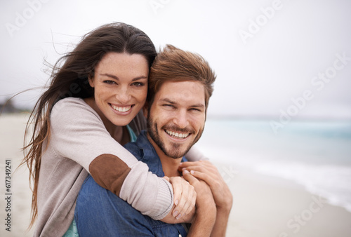 Couple on beach, portrait and hug with travel and holiday, love and care with trust and happiness. Freedom, mockup space and happy man with woman outdoor, summer vacation and ocean with support
