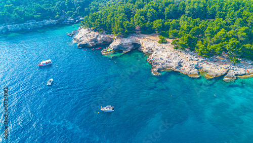 Aerial view of Famous Cyclone beach near Pula. Rocks in clear water. Istria. Croatia