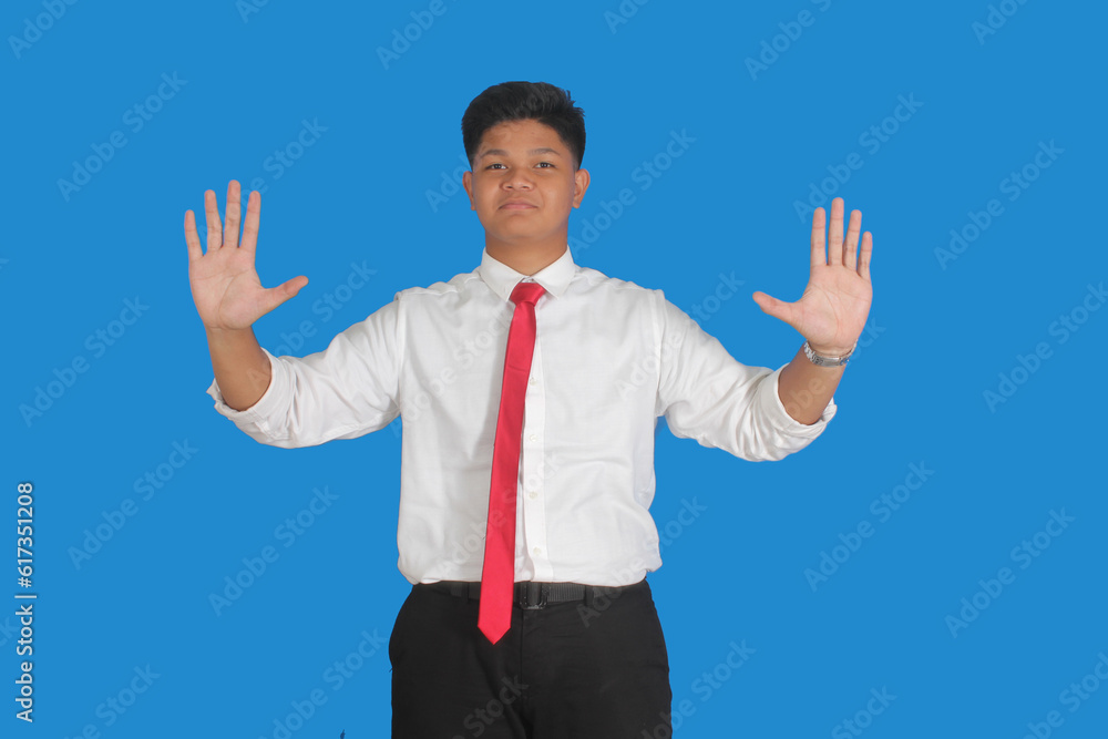 Asian male party cadre in tie pointing up with number five finger smiling confident and happy for election campaign isolated on blue background.
Asian male party cadre in tie pointing up with number five finger smiling confident and happy for election campaign isolated on blue background.