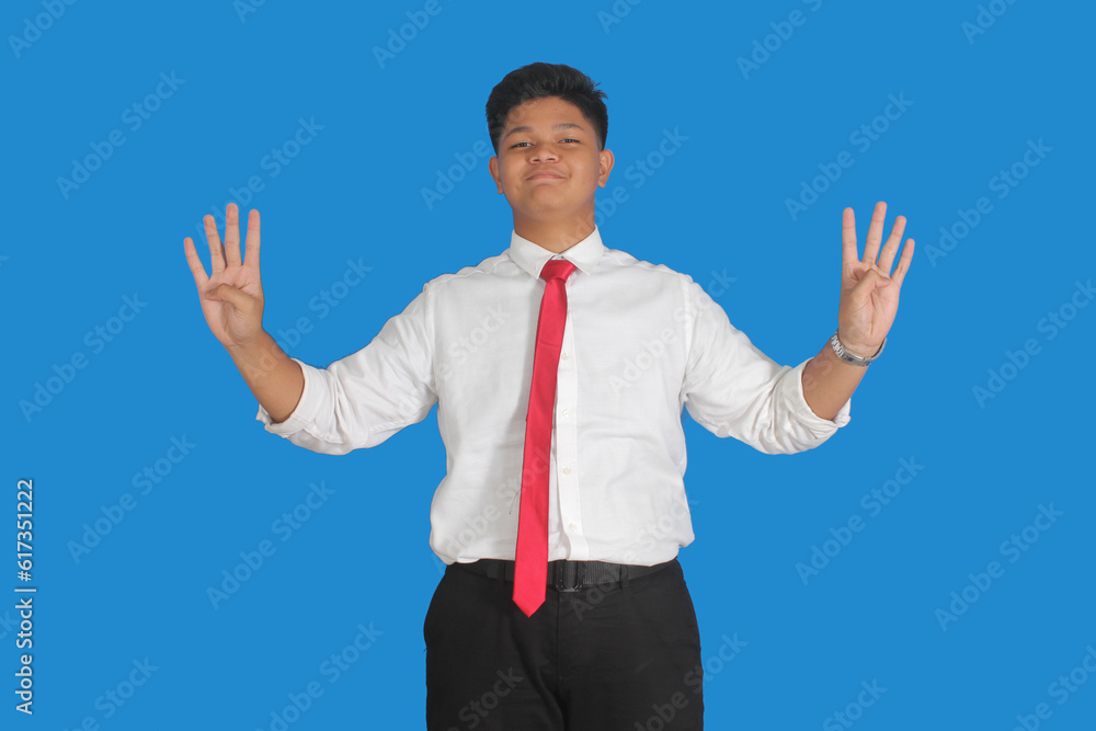Asian male party cadre in tie pointing up with number five finger smiling confident and happy for election campaign isolated on blue background.
Asian male party cadre in tie pointing up with number five finger smiling confident and happy for election campaign isolated on blue background.