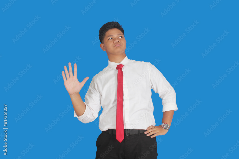 Asian male party cadre in tie pointing up with number five finger smiling confident and happy for election campaign isolated on blue background.
Asian male party cadre in tie pointing up with number five finger smiling confident and happy for election campaign isolated on blue background.