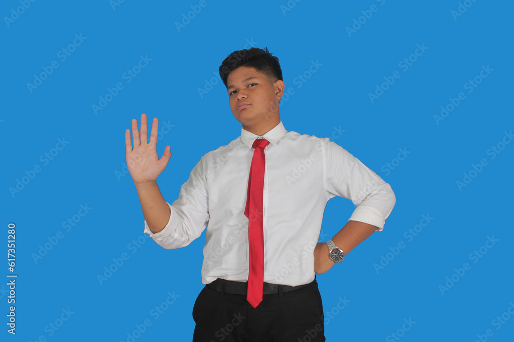 Asian male party cadre in tie pointing up with number five finger smiling confident and happy for election campaign isolated on blue background.
Asian male party cadre in tie pointing up with number five finger smiling confident and happy for election campaign isolated on blue background.