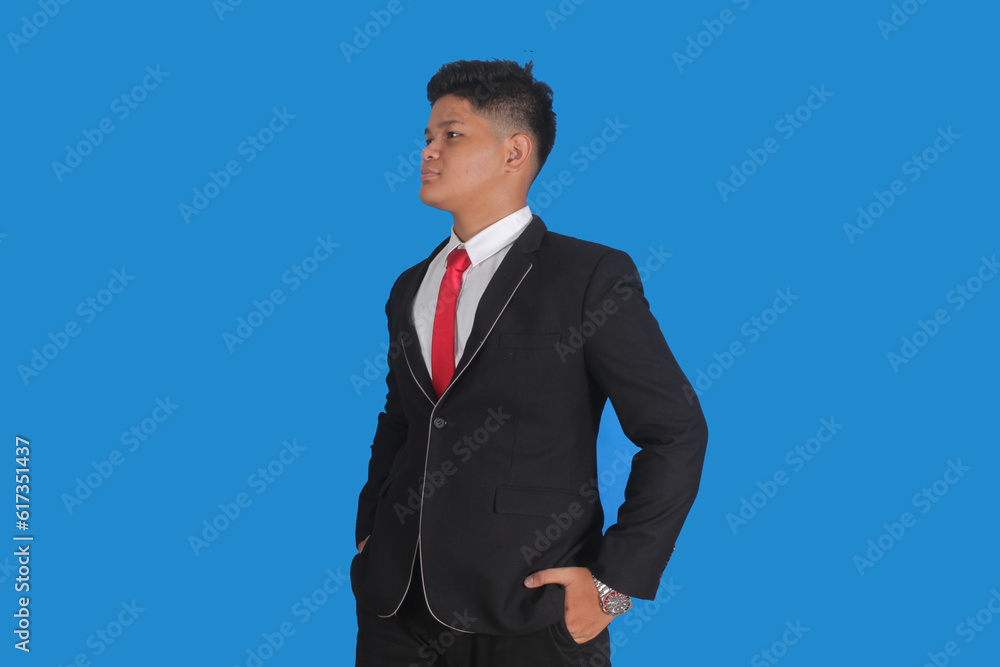Asian man with serious expression wearing black suit Asian man with serious expression wearing black suit
