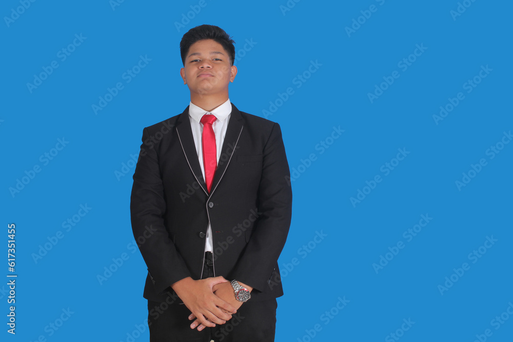Asian man with serious expression wearing black suit Asian man with serious expression wearing black suit