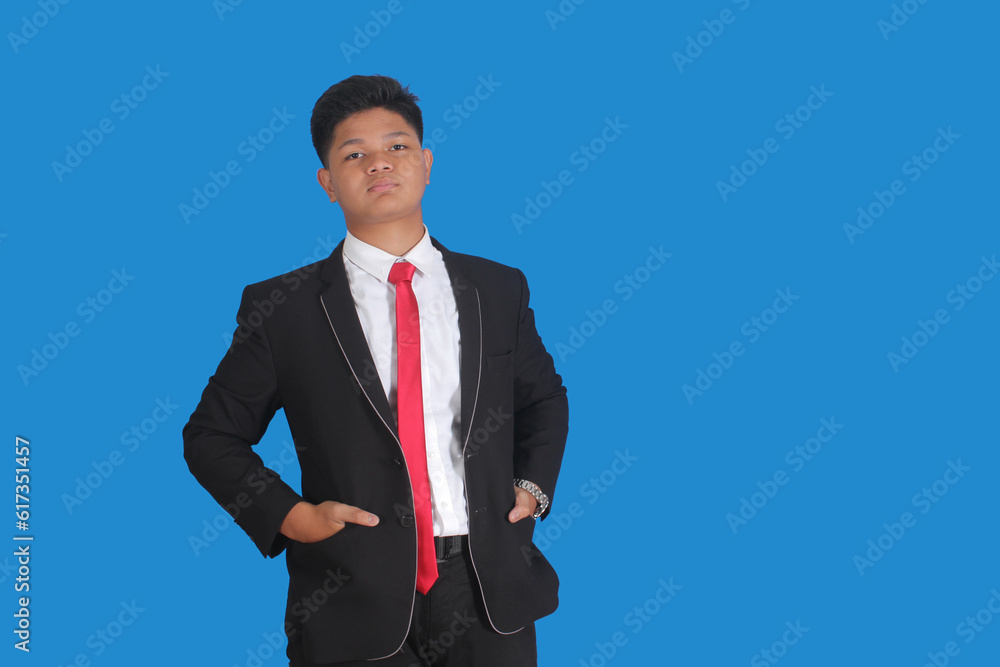 Asian man with serious expression wearing black suit Asian man with serious expression wearing black suit