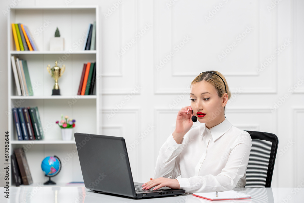 customer service cute blonde girl office shirt with headset and computer talking to a client customer service cute blonde girl office shirt with headset and computer talking to a client