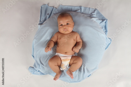 Adorable baby boy in pampers
