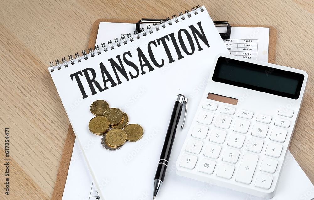 TRANSACTION text with chart and calculator and coins , business concept TRANSACTION text with chart and calculator and coins , business concept