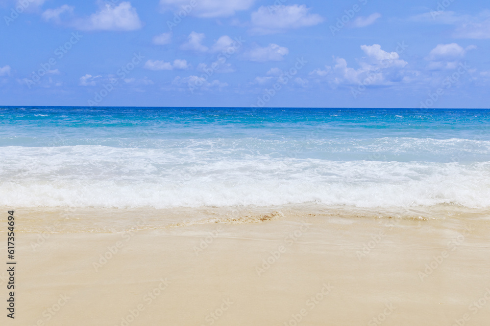 Light blue sea waves on clean sandy beach, Tropical white sand beach and soft sunshine background