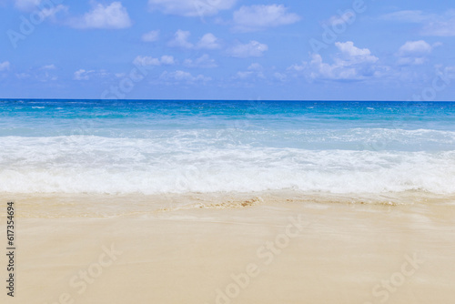 Light blue sea waves on clean sandy beach  Tropical white sand beach and soft sunshine background