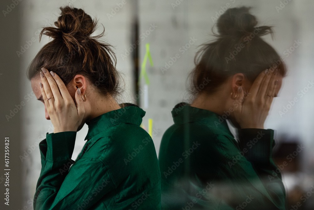 Young sad woman in office, having problem. - obrazy, fototapety, plakaty 