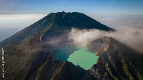Aerial view flying to mount Kawah Ijen crater, Sulfur mining in an active volcano, Java, Indonesia 
