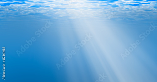 Underwater blue ocean background in sea with sun beam