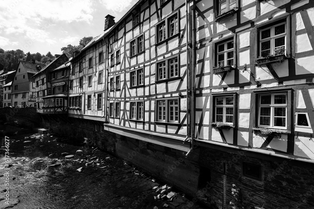 Monschau panorama with Rur river. The historic town center has many preserved half-timbered houses. Black and white vintage with truss facades. Monuments and sight are a tourist attraction near Aachen