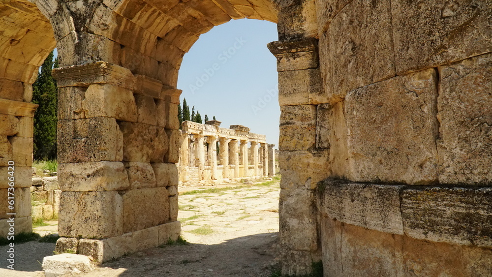 Ruins of ancient latrine toilet at Hierapolis and city gate