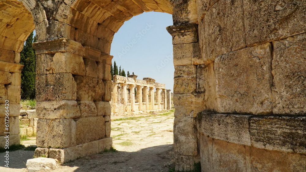 Ruins of ancient latrine toilet at Hierapolis and city gate Ruins of ancient latrine toilet at Hierapolis and city gate