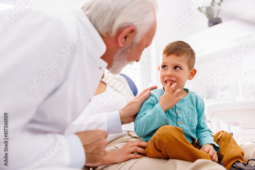 Little boy having checkup at dentist office