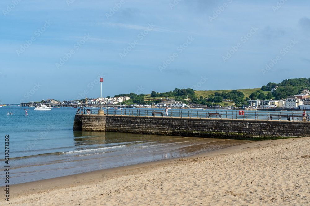 The sandy Swanage Beach with the Banjo Pier, - Swanage, UK