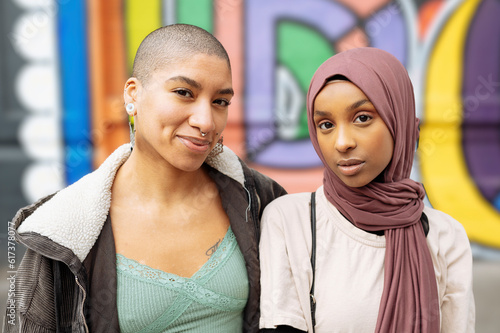 Portrait of young women at mural wall