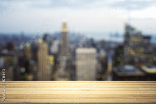 Blank wooden tabletop with beautiful blurry skyline at night on background  mockup