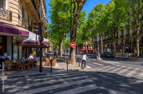 Cozy street with tables of cafe  in Paris, France. Cityscape of Paris. Architecture and landmarks of Paris © Ekaterina Belova