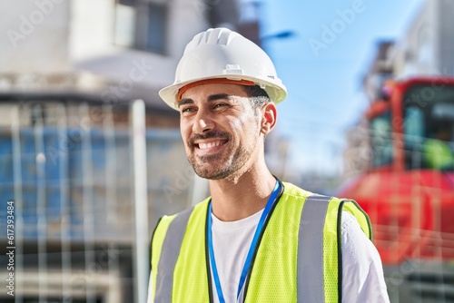 Young hispanic man architect smiling confident standing at street