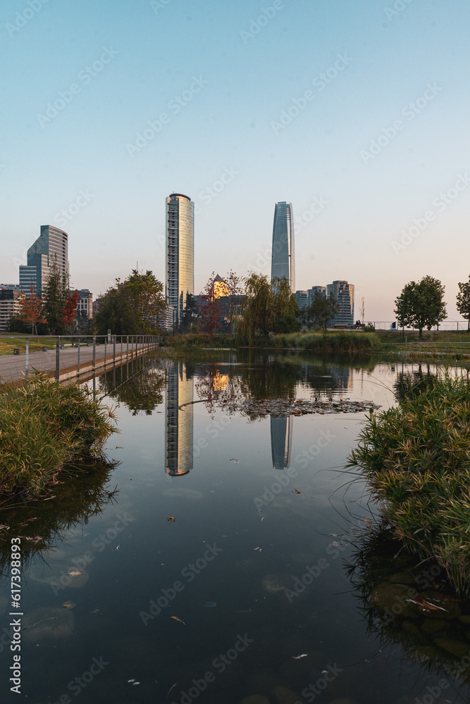 Fototapeta premium pink sky sunset in a park viewing the skyline of santiago de chile