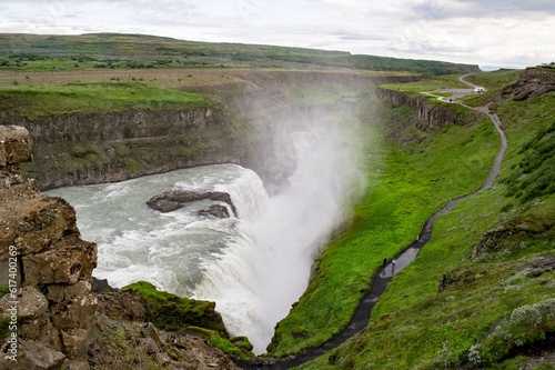 Gullfoss waterfall in Iceland, Europe viewed from above with unrecognizable tourists