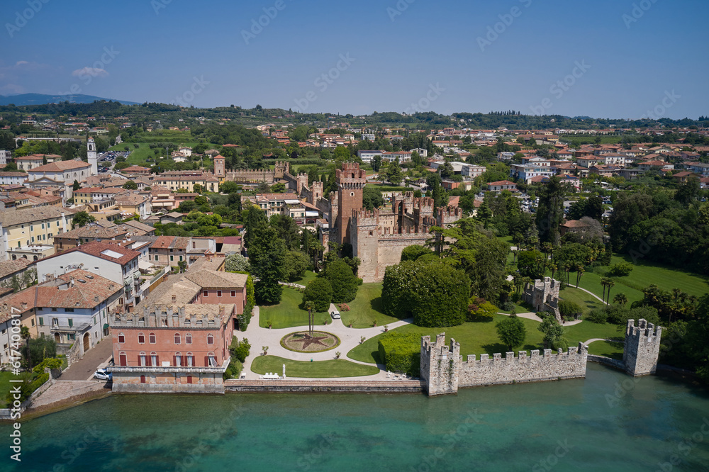 Aerial panorama of the popular resort, Lazise on Lake Garda. Castello Scaligero di Lazise on Lake Garda in Italy, aerial view. Sights of Italy. Historic city center of Lazise.