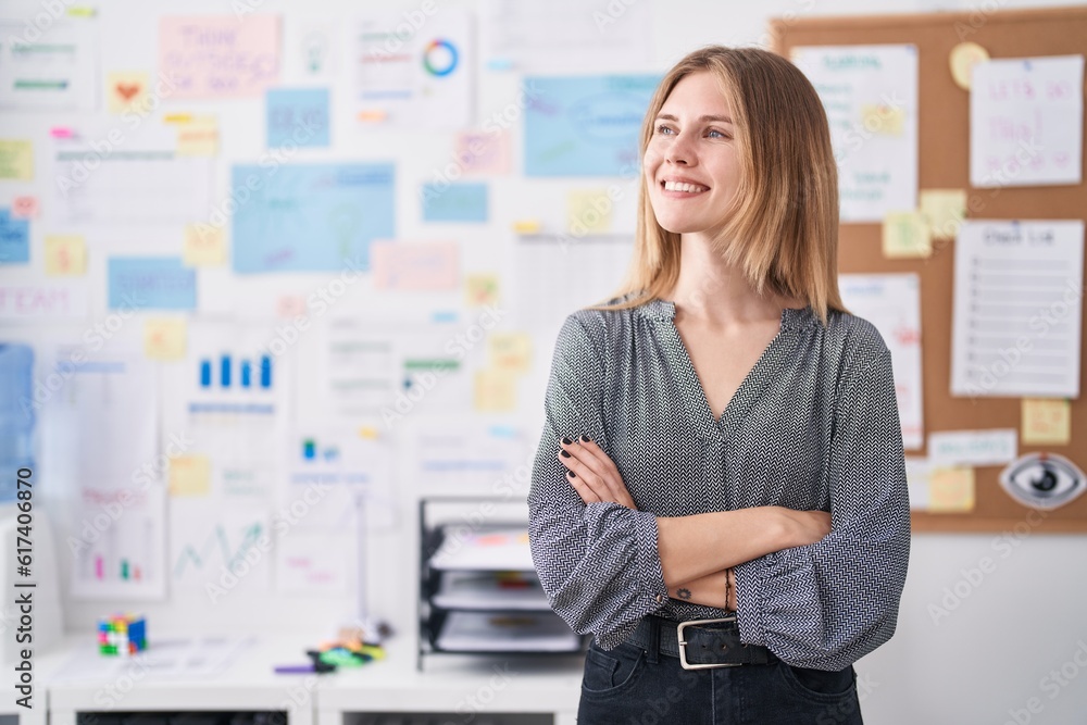 Young blonde woman business worker smiling confident standing with arms crossed gesture at office Young blonde woman business worker smiling confident standing with arms crossed gesture at office