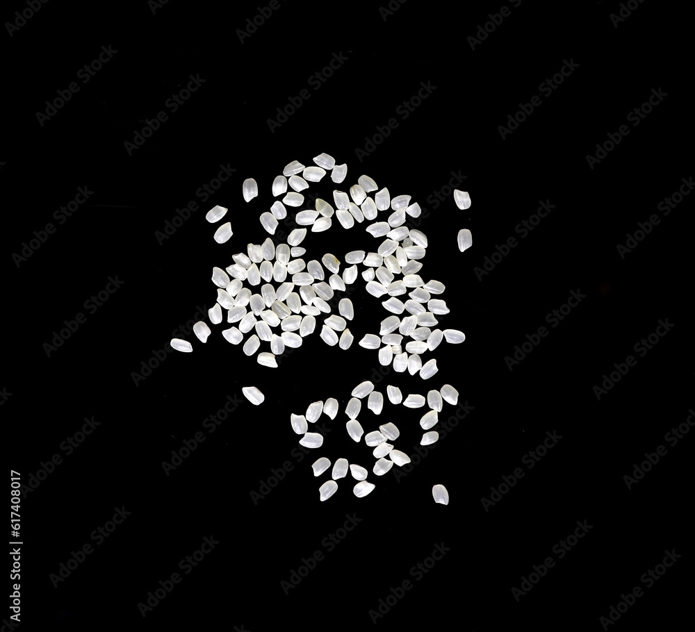 Heaps of uncooked Japanese short grain rice piled together isolated on black background.
Heaps of uncooked Japanese short grain rice piled together isolated on black background.