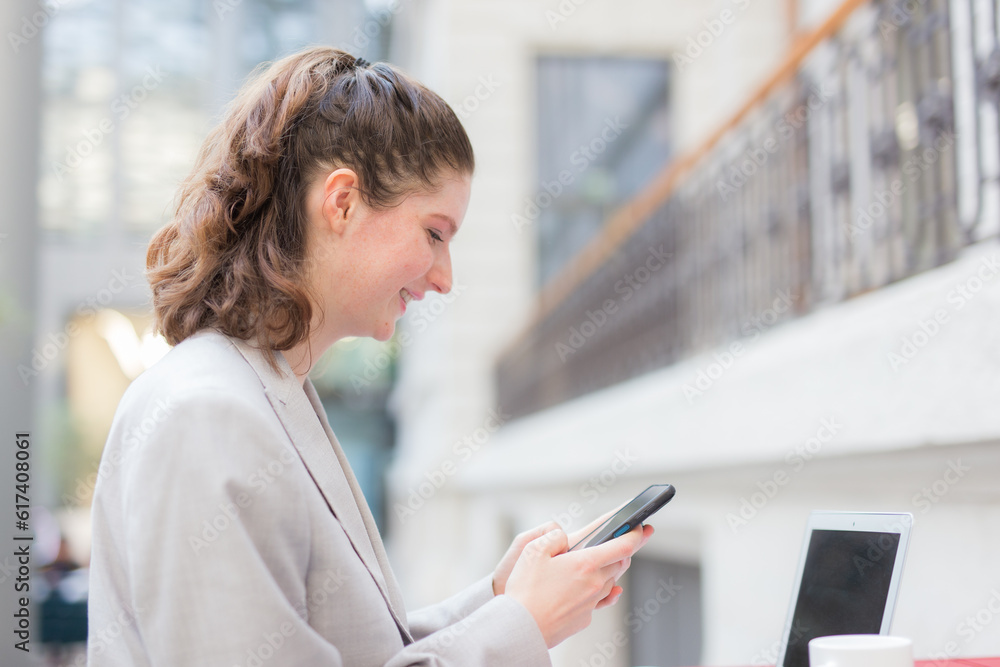 Fototapeta premium Businesswoman using a mobile phone