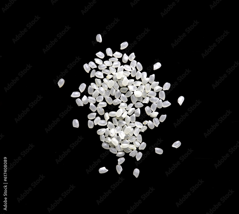 Heaps of uncooked Japanese short grain rice piled together isolated on black background.
Heaps of uncooked Japanese short grain rice piled together isolated on black background.