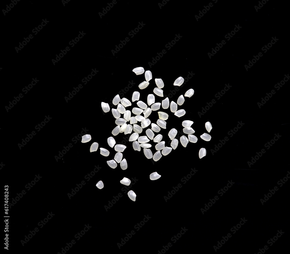 Heaps of uncooked Japanese short grain rice piled together isolated on black background.
Heaps of uncooked Japanese short grain rice piled together isolated on black background.