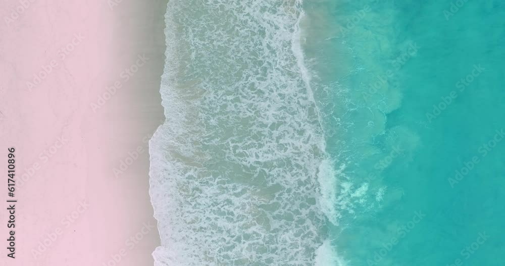 aerial top view The waves slowly swept towards the shore..White foam waves in the bright green sea lapping on the white sandy beach..white bubble waves,and clear sand landscape. freedom beach. aerial top view The waves slowly swept towards the shore..White foam waves in the bright green sea lapping on the white sandy beach..white bubble waves,and clear sand landscape. freedom beach.