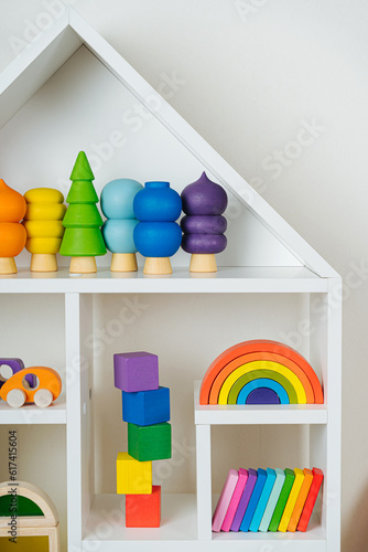 Wallpaper Mural White house shaped shelving with colorful wooden toys on white wall. Interior design. Organizing and Storage Ideas in nursery. Torontodigital.ca
