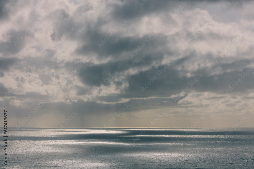 Storm clouds over the Pacific ocean at dusk Storm clouds over the Pacific ocean at dusk