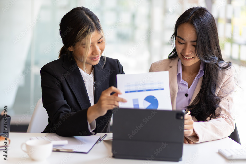 Colleagues working together in the office. Businesswoman discussing with colleagues at work about work and presenting ideas for starting a new business project. Colleagues working together in the office. Businesswoman discussing with colleagues at work about work and presenting ideas for starting a new business project.