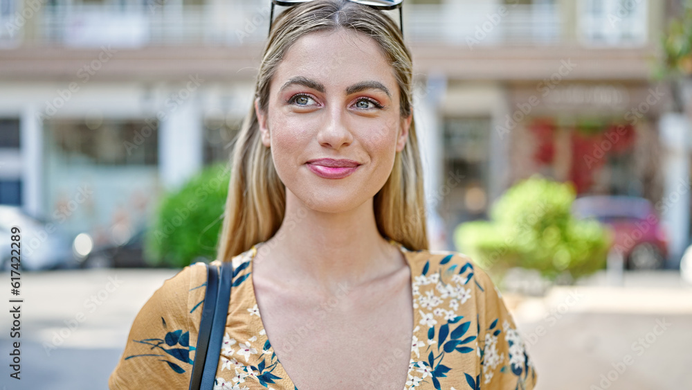 Young blonde woman smiling confident standing at street Young blonde woman smiling confident standing at street