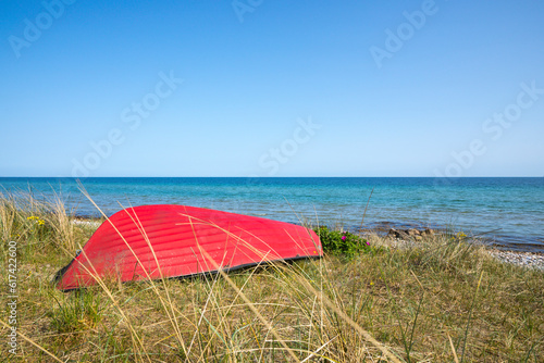 Red row boat at Baltic Sea coast, island of Als, Denmark