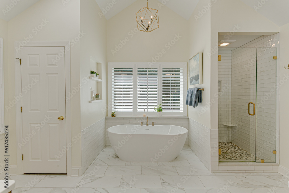 Luxurious Modern Primary Bathroom Interior With White Soaking Tub And