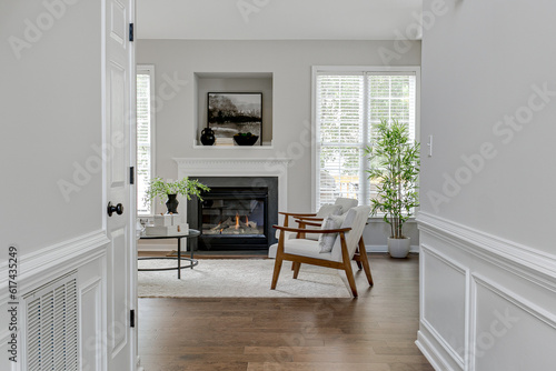 Obraz na płótnie Interior Modern Sustainable The Family Room Interior With Wooden Boucle Accent Chairs And Black Fireplace With Styled Mantle w salonie