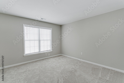 Amazing Large Empty Spacious interior with grey millennial modern minimal walls carpet and outdoor window views with nobody