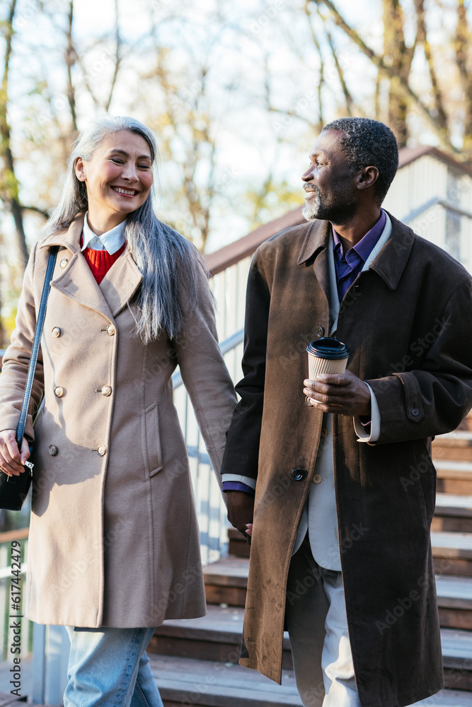 Storytelling image of a multiethnic senior couple in love Storytelling image of a multiethnic senior couple in love