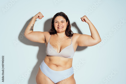Plus size woman posing in studio in lingerie © oneinchpunch