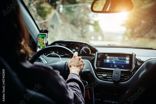 Schilderij op canvas A woman holding the steering wheel tightly and driving a car