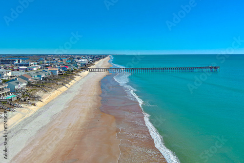 Straight-on aerial photo of the Surf City fishing pier. 