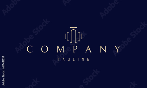 Vector golden logo on which an abstract image of an arched passage with columns on the sides.