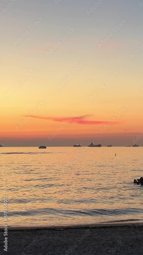 Beautiful clear big sunrise, sunset, seagulls sit on the water and fly. A big red hot sun in the reflection of the sea above the horizon. High quality 4k footage Beautiful clear big sunrise, sunset, seagulls sit on the water and fly. A big red hot sun in the reflection of the sea above the horizon. High quality 4k footage
