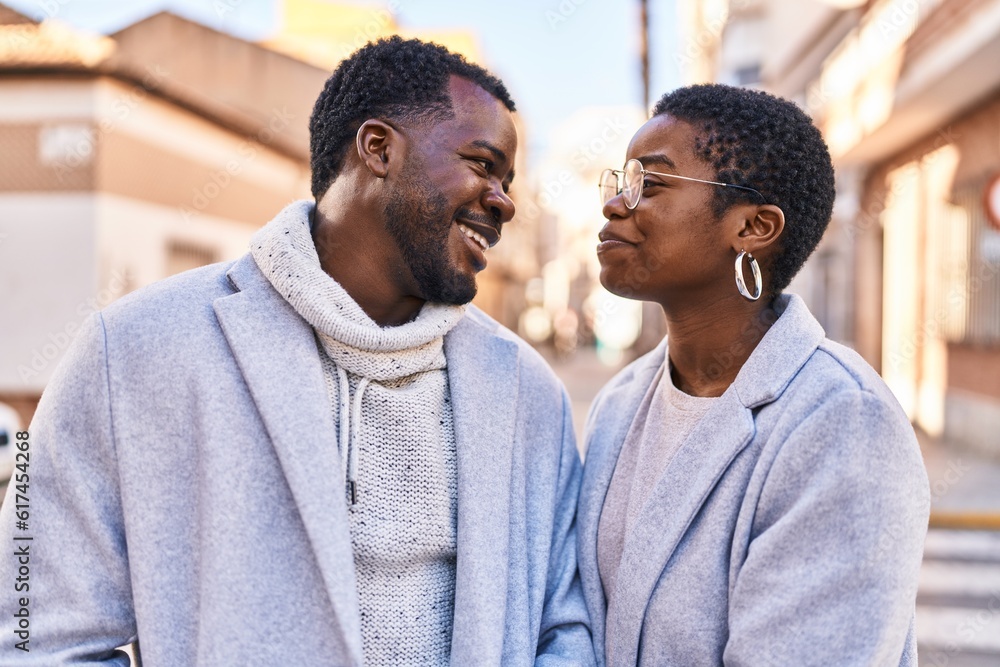 Man and woman couple smiling confident standing together at street Man and woman couple smiling confident standing together at street